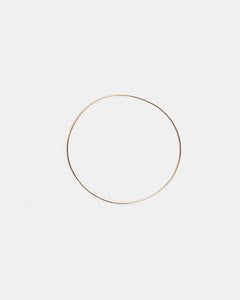 Thin Bangle in 14K Gold by Kathleen Whitaker at Mohawk General Store