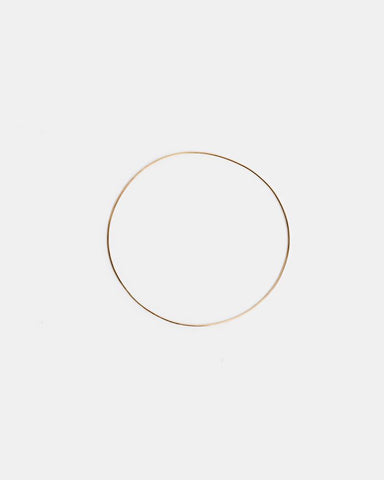 Thin Bangle in 14K Gold by Kathleen Whitaker at Mohawk General Store
